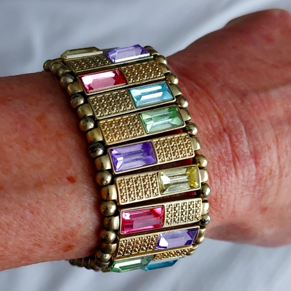 Stretch gold tone multi colored gems